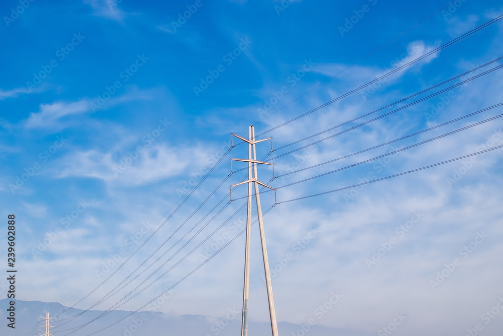 Electricity power lines and blue sky and clouds