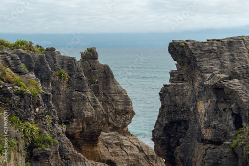 Cliffs in the ocean, world famous Pancake Rocks, West Coast of South Island New Zealand