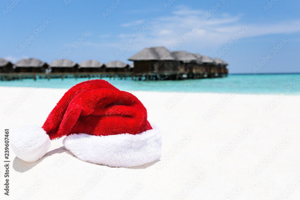 Santa hat on chair with water lodges on background Santa hat on chair with water lodges on background