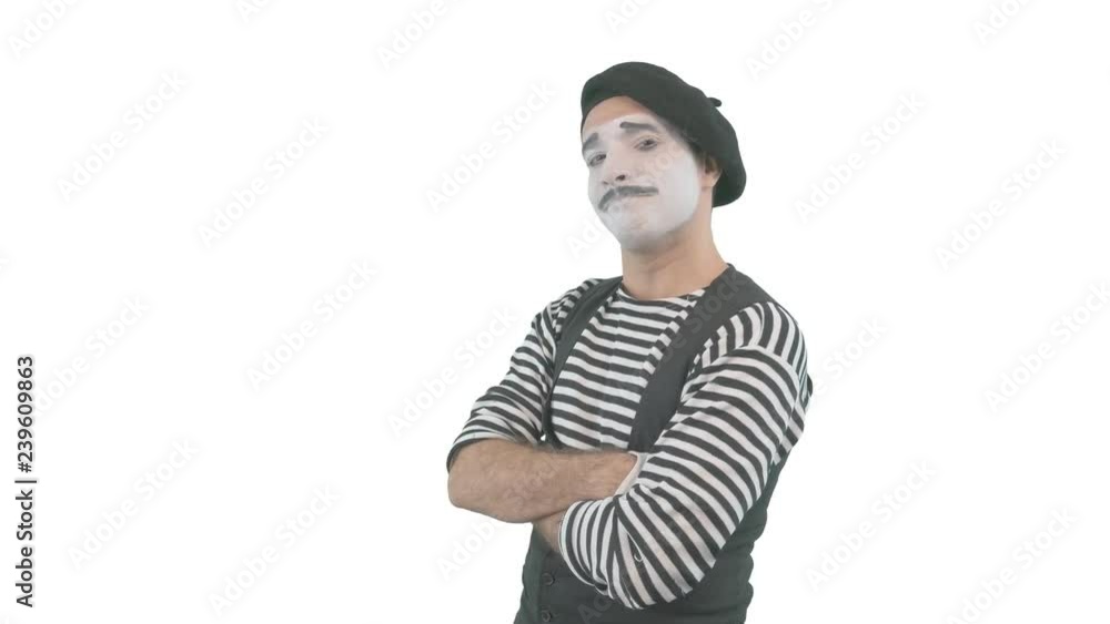 Happy mime showing thumbs up. Cheerful behavior and broad smile of a male actor during the pantomime show. Isolated on white background. Happy mime showing thumbs up. Cheerful behavior and broad smile of a male actor during the pantomime show. Isolated on white background.