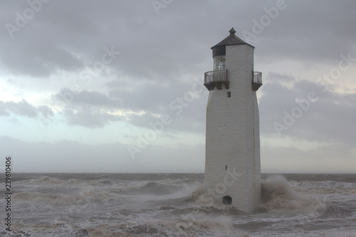 Southerness Lighthouse being battered by a heavy storm. Dumfriesshire  Scotland.