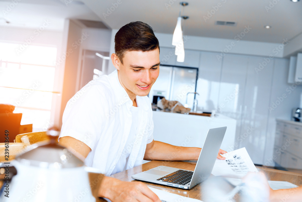 Man working on laptop at home Man working on laptop at home