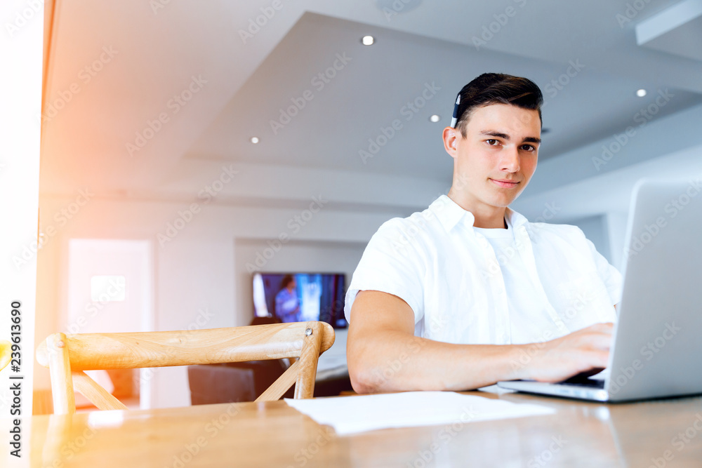Man working on laptop at home Man working on laptop at home
