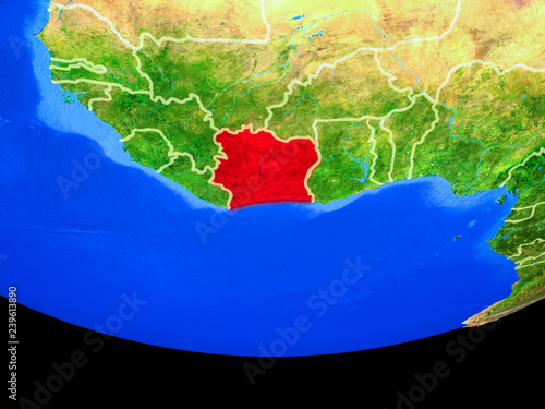 Ivory Coast from space on model of planet Earth with country borders. photo