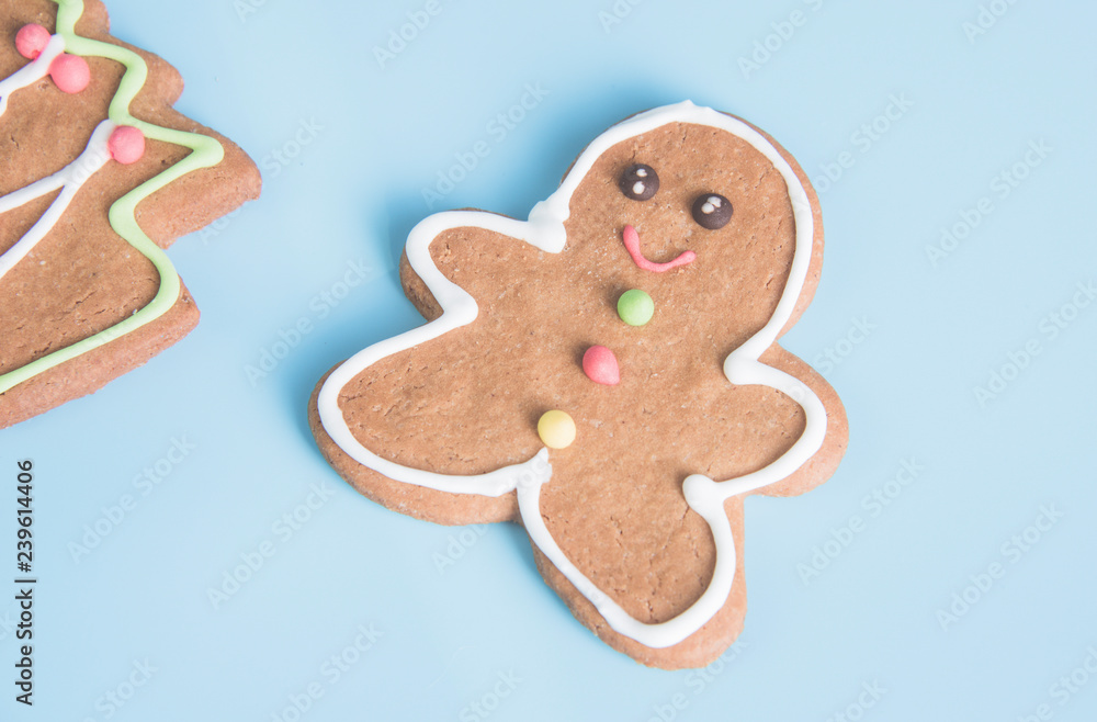 Christmas gingerbread cookies isolated on light blue pastel background Christmas gingerbread cookies isolated on light blue pastel background
