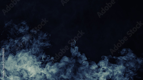 Abstract blue smoke mist fog on a black background. Texture. Design element.   © Victor