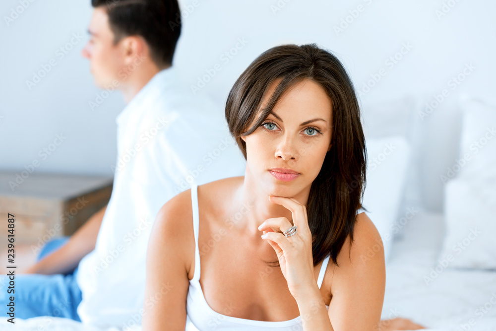 Couple in stress sitting on the bed Couple in stress sitting on the bed