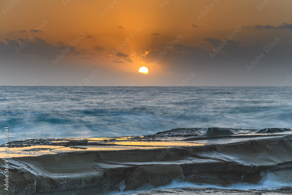 Hazy Sunrise Seascape from Rock Platform