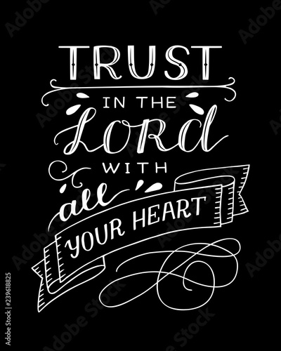 Hand lettering with bible verse Trust in the Lord with your heart on black background. Proverbs