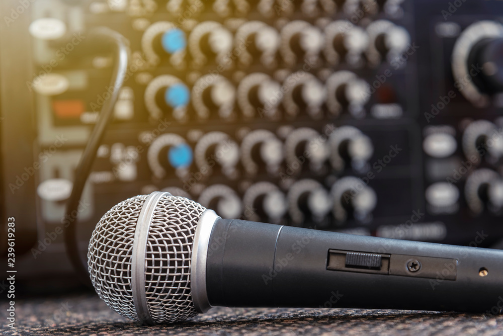 Closeup microphone with blurred sound mixer background. Stock Photo | Adobe  Stock