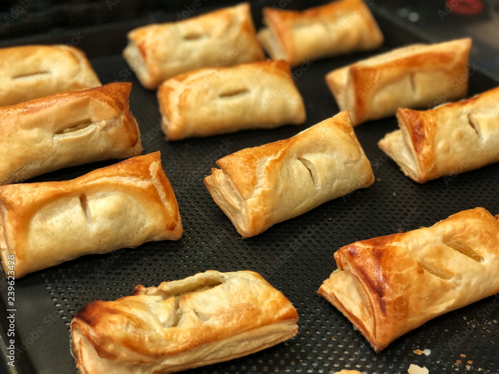 Homemade Puff pastry with pineapple jam, chicken curry , purple potato on black bake tray. Bakery for party , Delicious and unhealthy Homemade Puff pastry with pineapple jam, chicken curry , purple potato on black bake tray. Bakery for party , Delicious and unhealthy
