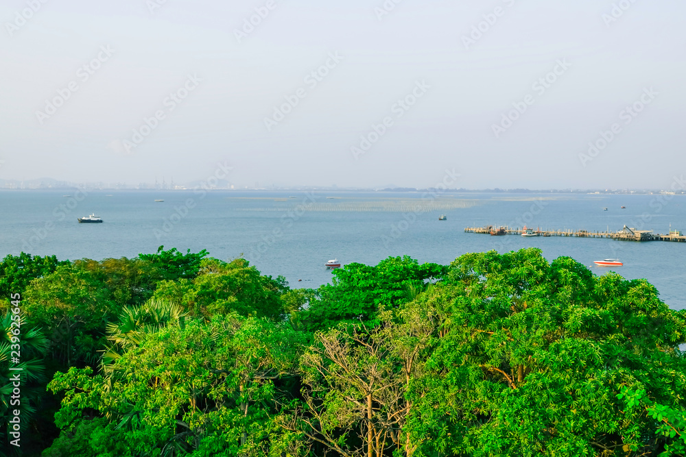 Seaside town, tower and city beside the sea, horizontal sea view and blue sky, . Bird eyes view from balcony, minimal view of ship on the sea