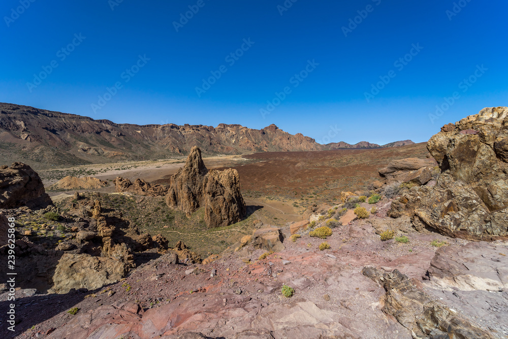 Obraz premium The lava fields of Las Canadas caldera of Teide volcano and rock formations - Roques de Garcia. Tenerife. Canary Islands. Spain.