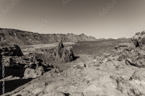 The lava fields of Las Canadas caldera of Teide volcano and rock formations - Roques de Garcia. Tenerife. Canary Islands. Spain. Black and white.
