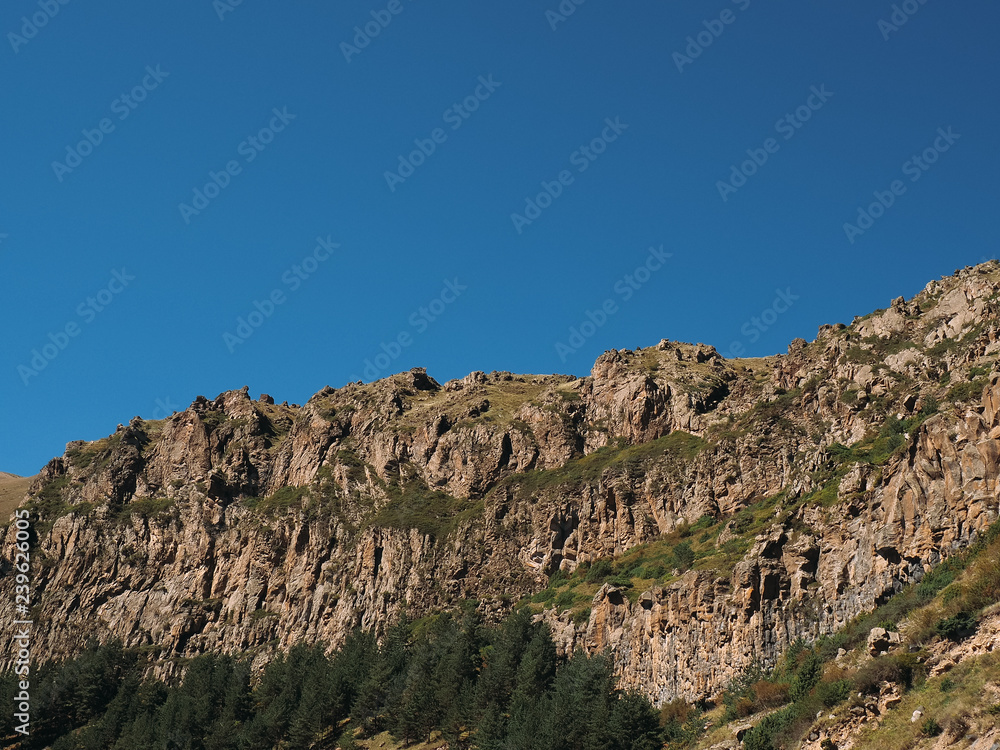 Landscape picture. Caucasian mountains against the sky Landscape picture. Caucasian mountains against the sky