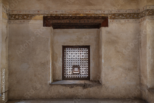 Interleaved grunge wooden window (Mashrabiya) at historic Beit El Set Waseela building (Waseela Hanem House), Medieval Cairo, Egypt photo
