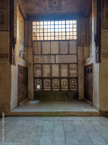 Interleaved wooden window (Mashrabiya), wooden embedded cupboards, and wooden decorated ceiling at ottoman historic Beit El Set Waseela building (Waseela Hanem House), Old Cairo, Egypt photo