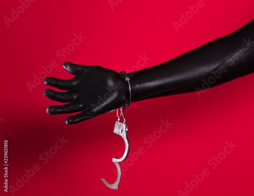 фотографія handcuffed fetish hands in latex