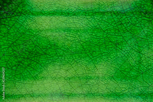 Closeup green Celadon ceramic texture background vintage style photo