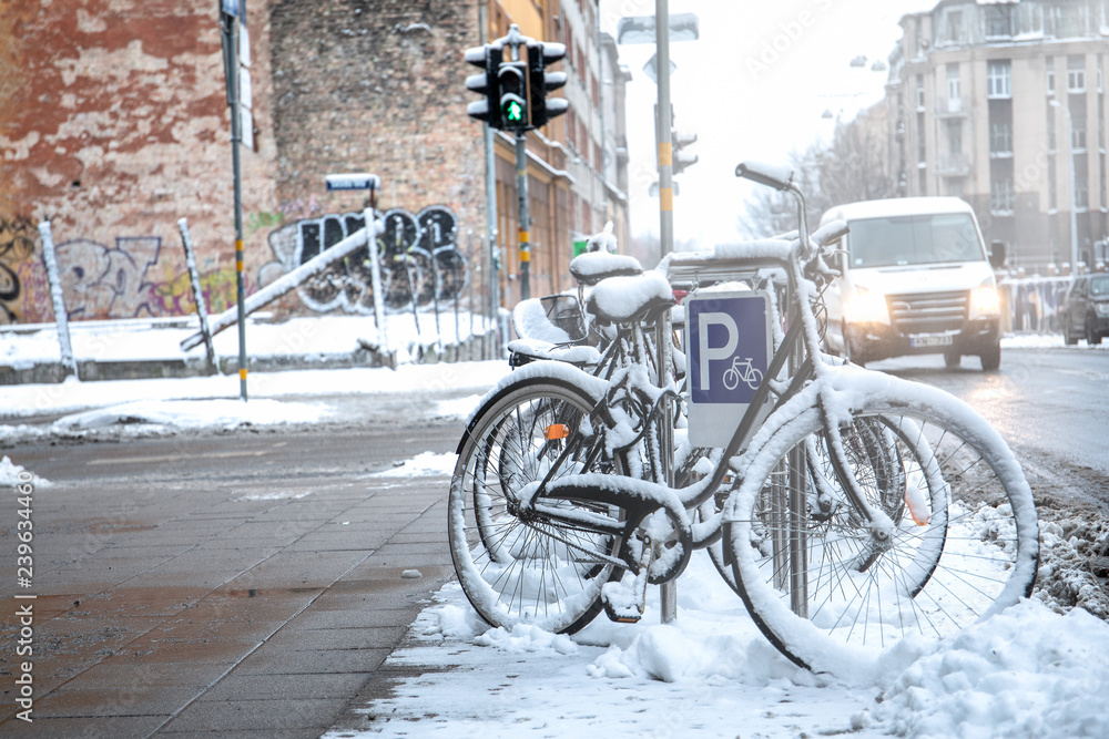 Bicycle covered with snow. City and transport Bicycle covered with snow. City and transport