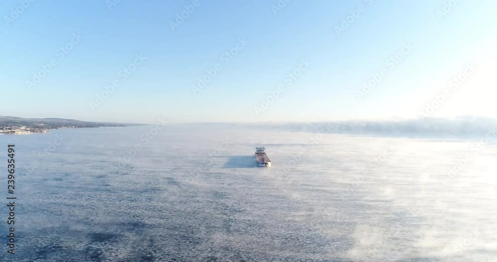 Aerial of Cargo Ship on Frozen Lake Superior - Sea Smoke Aerial of Cargo Ship on Frozen Lake Superior - Sea Smoke