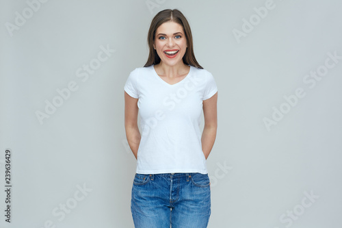 Happy woman dressed casual white t shirt with copy space.