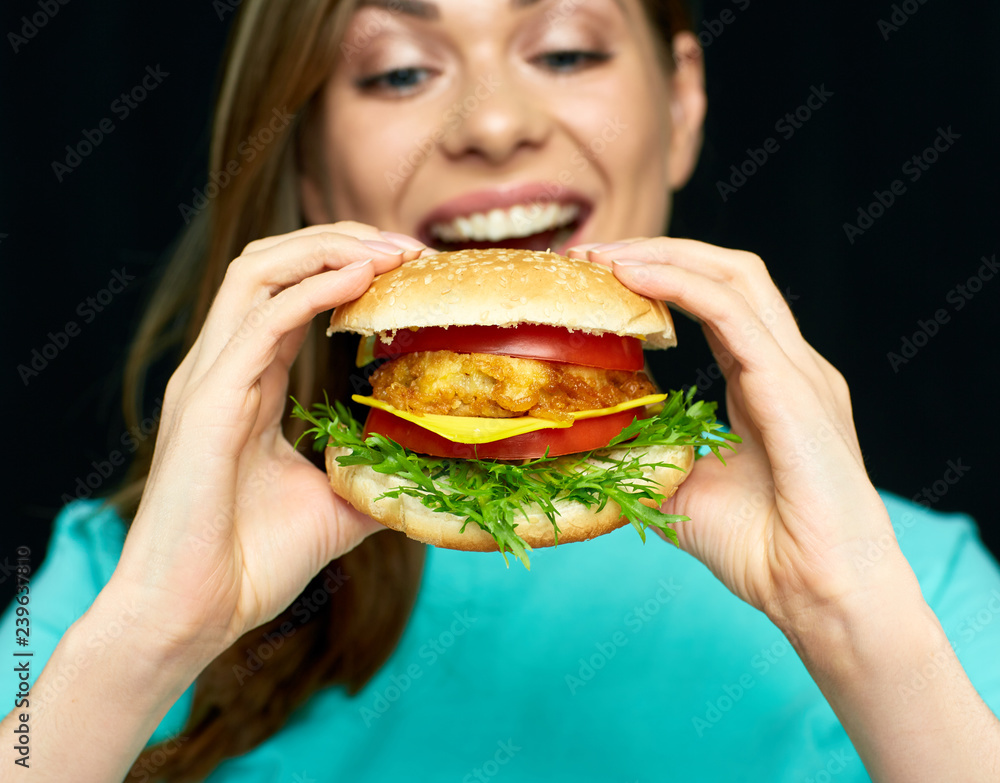 portrait of woman eating hamburger portrait of woman eating hamburger