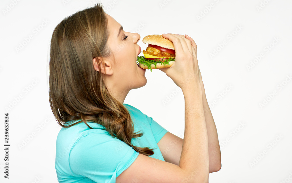 Woman eating fast food meal burger. Woman eating fast food meal burger.