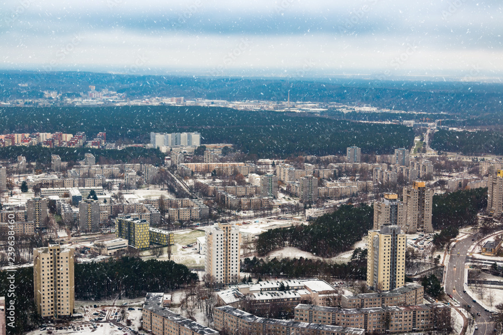 View of the city of Vilnius from the TV tower. Houses and roads. Winter landscape. Panorma.