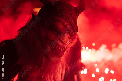Fire red. In the flames. Krampus, Christmas devils