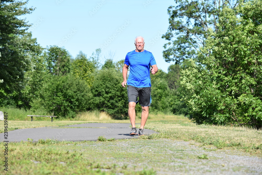 Happy Old Senior Grandfather Wearing Sneakers Walking In Park