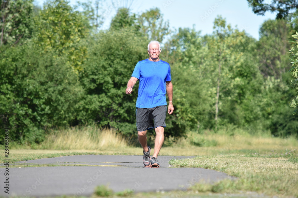 Fototapeta premium Happy Old Senior Grandpa Walking In Park