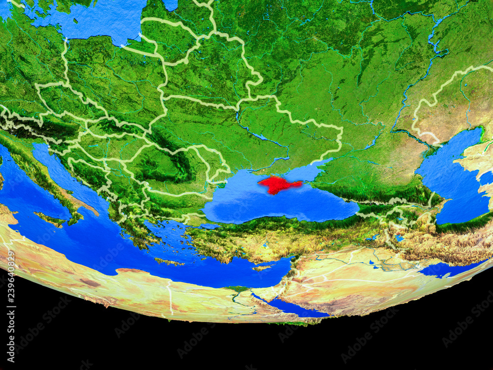 Crimea from space on model of planet Earth with country borders.