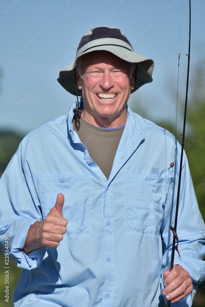 Old Senior Male Fisherman With Thumbs Up With Rod And Reel Fishing Stock  Photo