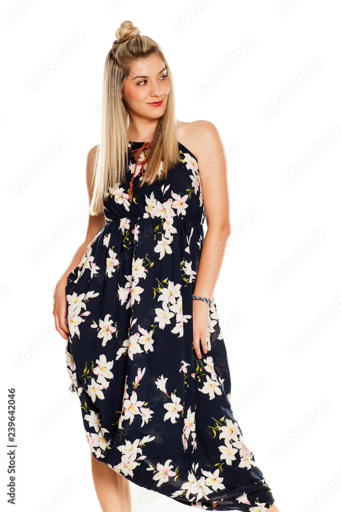 a woman in a long dress posing on a white background a woman in a long dress posing on a white background