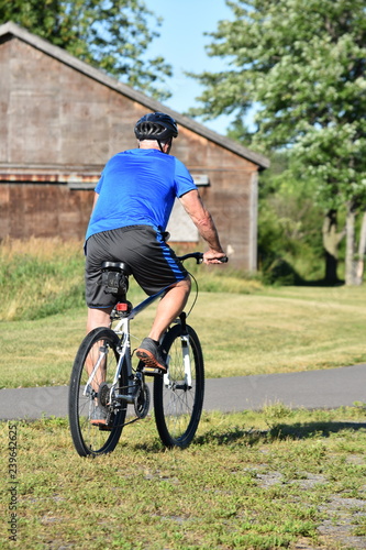 Exercising Athlete Retiree Male Cyclist Exercising © dtiberio