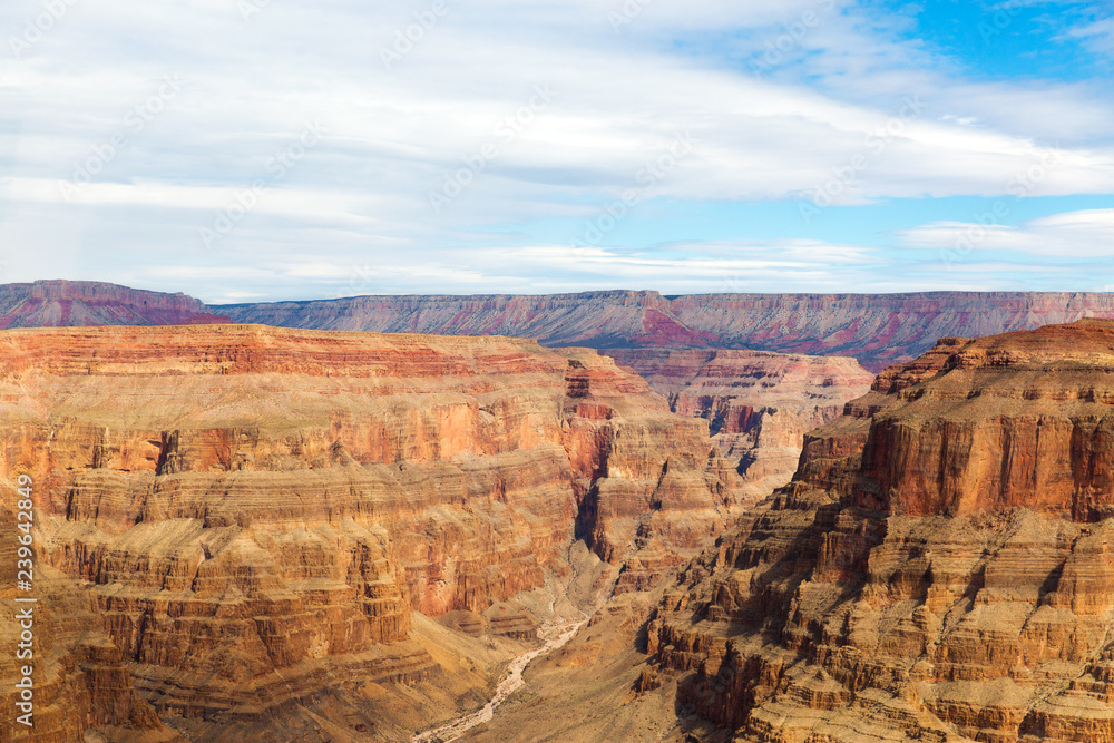 landscape and nature concept - aerial view of grand canyon and arid river bed from helicopter