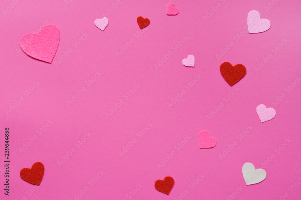 Felt hearts on pink background. St. Valentine's Day concept. Top view, flat lay. Copy space