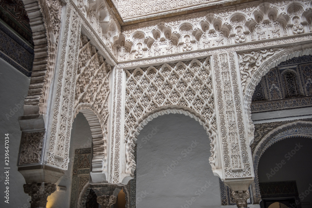 Beautiful architecture of the famous Alcazar of Seville Royal Palace. It is one of the most famous historical palaces in Spain and boasts of the finest architectural beauty.