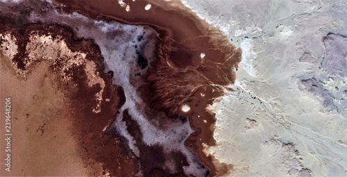 Fototapeta The salt of the earth, black gold, polluted desert sand, abstract photo of the deserts of Africa from the air. aerial view, Genre: Abstract Naturalism, from the abstract to the figurative