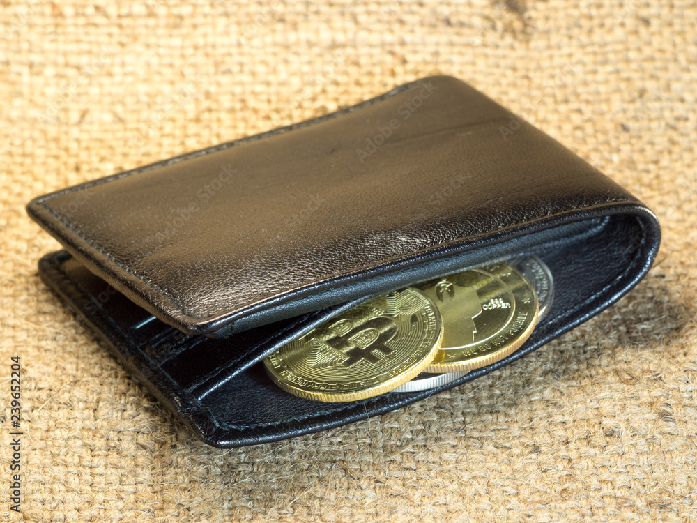 Bitcoin in a purse on rough burlap Bitcoin in a purse on rough burlap