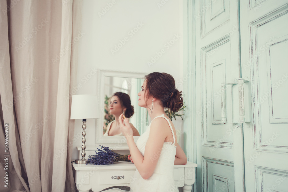 portrait of a young bride in a mirror with perfume portrait of a young bride in a mirror with perfume
