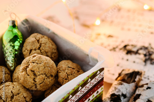 Danish Peppernuts (Pebernodder). Traditional Christmas danish cookies in a gift box. Cozy winter and Christmas setting, warm and homely. Danish hygge concept photo