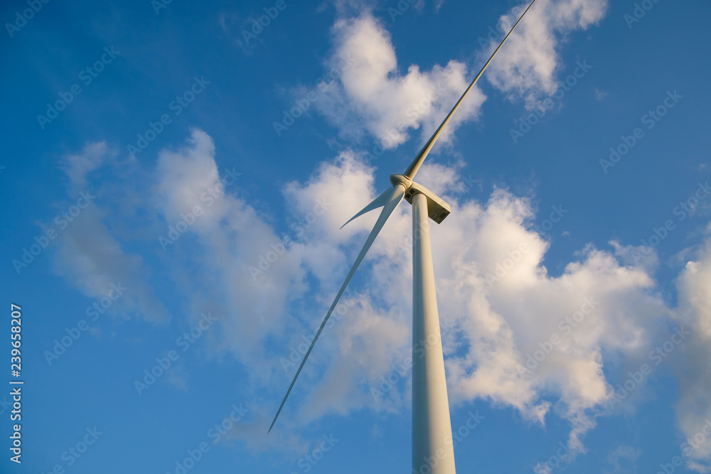 View up, bottom view of wind turbine, windmill isolated on blue sky background. Royalty high-quality free stock photo image looking up wind turbine, windmill energy converter in a blue sky background View up, bottom view of wind turbine, windmill isolated on blue sky background. Royalty high-quality free stock photo image looking up wind turbine, windmill energy converter in a blue sky background