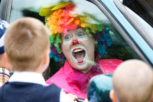 A woman clown laughs gaily.Joyful children's clown.Cheer children