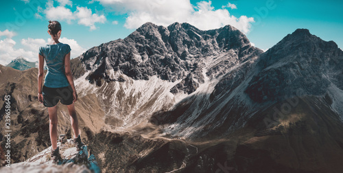 Woman looking at beautiful steep mountains