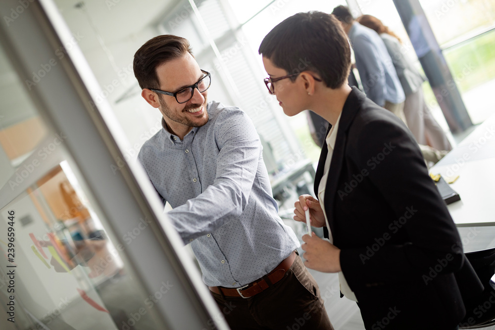 Businesspeople discussing together in conference room during meeting Businesspeople discussing together in conference room during meeting