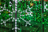 Blurred image of light bulbs outdoor. Christmas concept