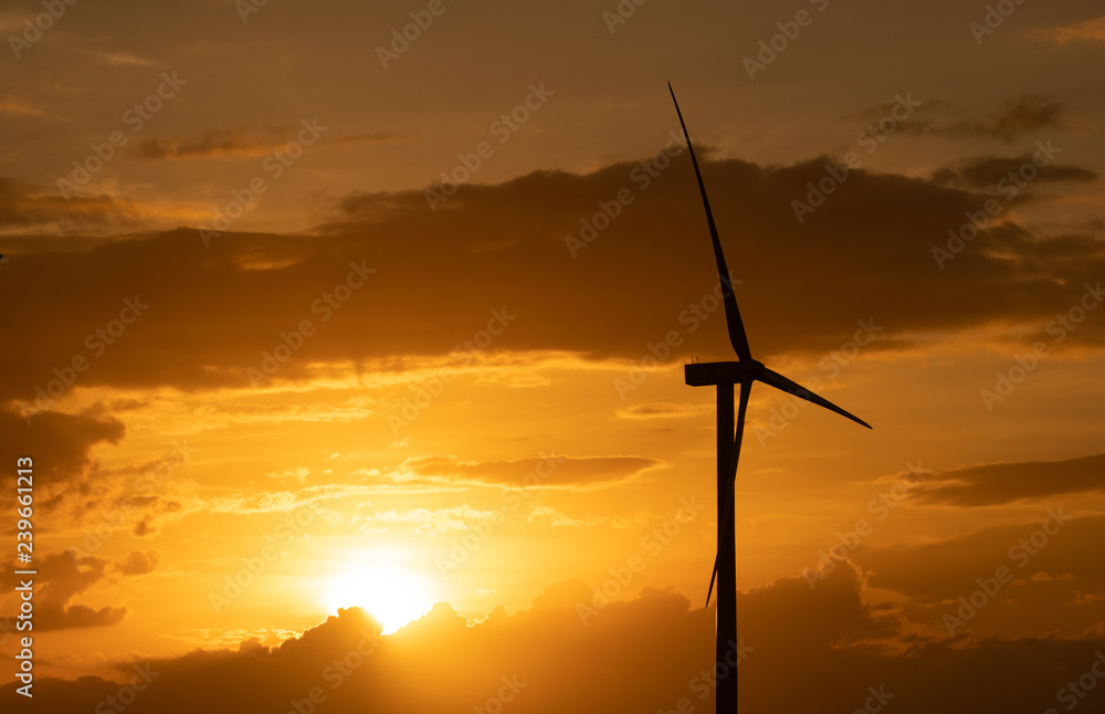 Wind turbine farm or windmill on golden sunset sky in summer day. High-quality stock photo image of wind turbine or windmill for clean energy concept. Energy Production with clean and Renewable Energy Wind turbine farm or windmill on golden sunset sky in summer day. High-quality stock photo image of wind turbine or windmill for clean energy concept. Energy Production with clean and Renewable Energy