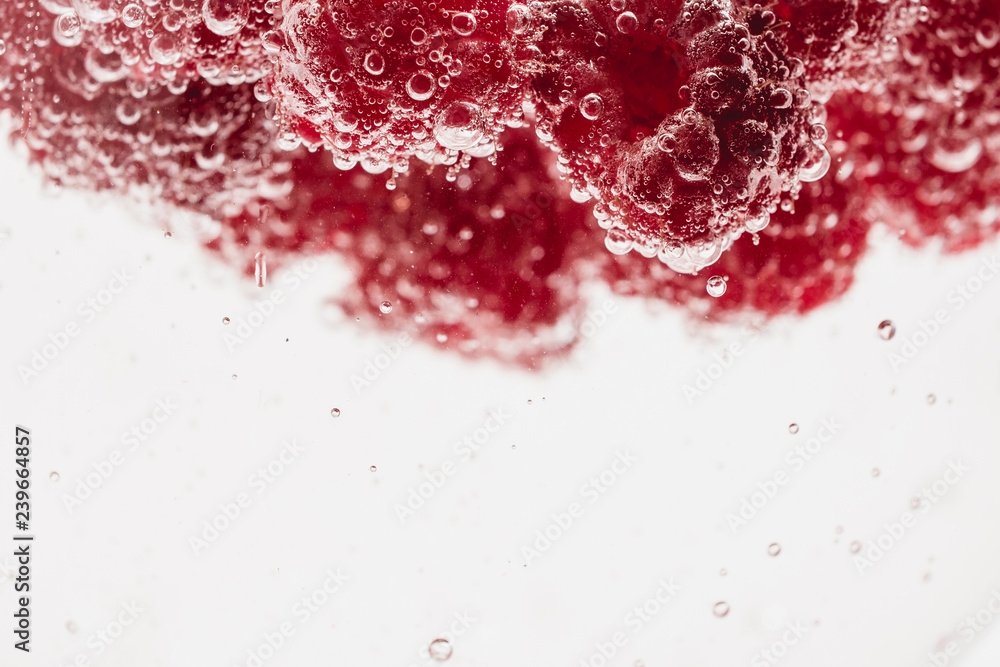 Fresh raspberries in water wiht air bubbles. Fresh raspberries in water wiht air bubbles.